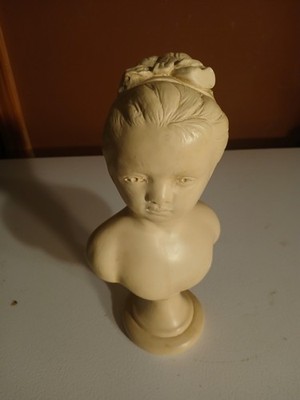 vintage Alexander Backer chalkware bust of a young girl with a bow in her hair.