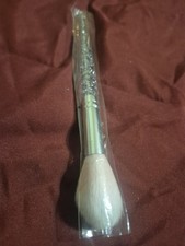 A Very Soft Makeup Brush has Glitter Hand
