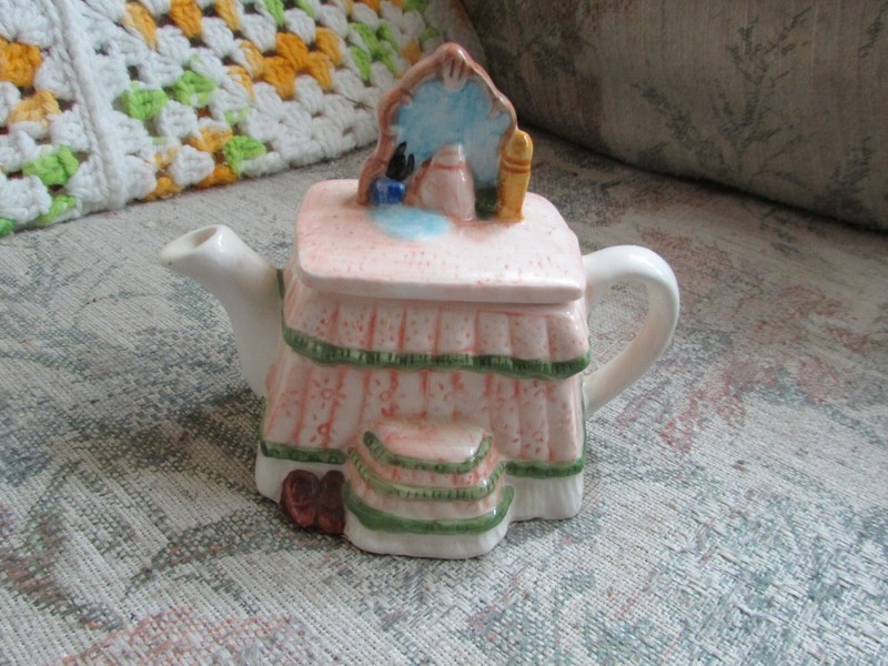 small dressing table teapot, with a couple of chips in the spout