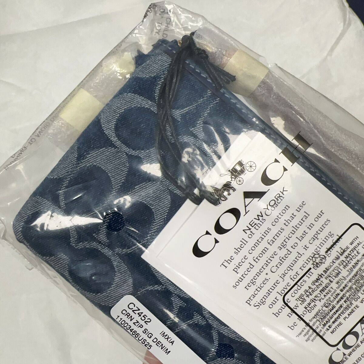 NWT Limited Coach CZ452 Signature Denim Corner Zip Wristlet NWT Limited Coach CZ452 Signature Denim Corner Zip Wristlet