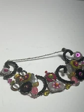 Beautiful bracelet by AYALA BAR  glass beads in pink green and yellow.