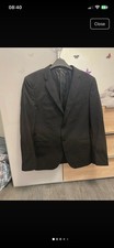Men’s suit from DKNY, size M (EU 48).