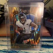 2025 Panini Select Football Travis Etienne Jr Bronze Shock /899 #130 Premier