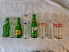 8 Vintage Soda Bottles 4 Coke(3 Different) Sprite, 7up, Squirter, Pepsi With Cap