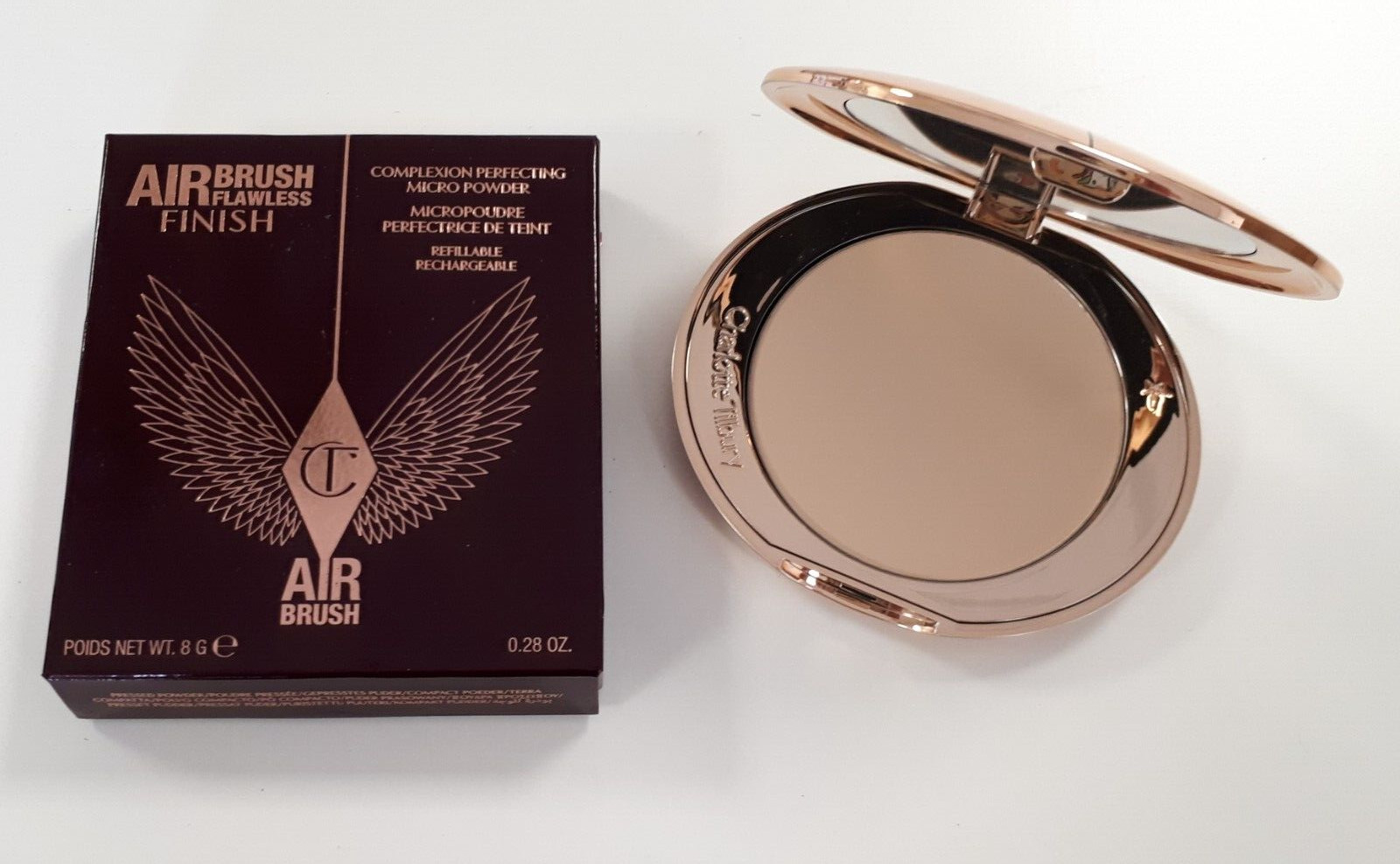 Poudre Airbrush Flawless Charlotte Tilbury 1 Fair poudre compacte fixatrice peaux claires