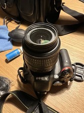 Nikon D D5100 16.2MP Digital SLR Camera - Black (Kit with VR 18-55 mm Lens)