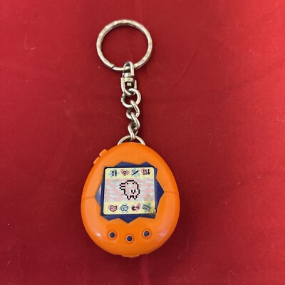 Vintage 1997 McDonalds Happy meal ￼Toy - Tamagotchi - Orange