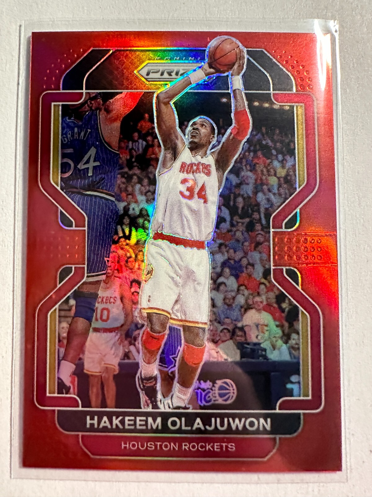 K105,373 - 2021-22 Panini Prizm Prizms Red #265 Hakeem Olajuwon #/299
