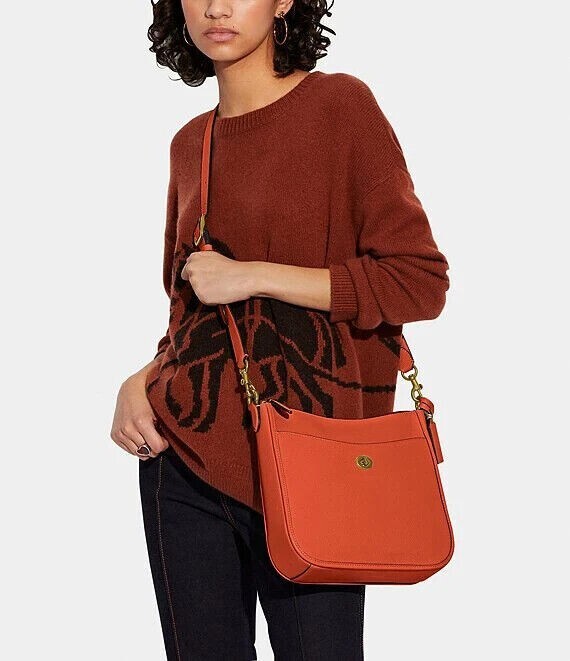 COACH チャールズ　ヴァーシティ　シグネチャー　ボディバッグ　オレンジ Restored Swinger 20 In Signature Jacquard With Varsity Patches