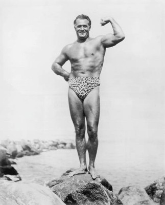 Italian born bodybuilder Charles Atlas flexing his bicep while posi- Old Photo