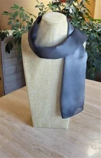 Unnamed oblong scarf; gray tones; textured fabric; 42 x 14 inches