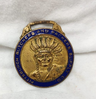 1910's Pittsburgh Butchers and Packers Supply Co Enameled Indian Chief Watch Fob