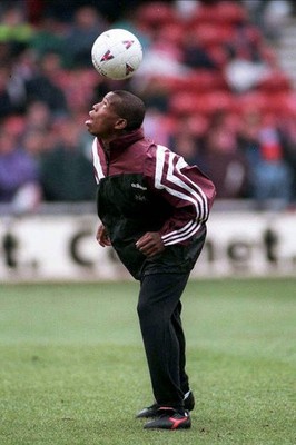Faustino Asprilla of Newcastle United heading before the Premier L- Old Photo