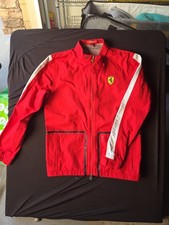 Official Scuderia Ferrari youth racing jacket in red. Features Ferrari shield   