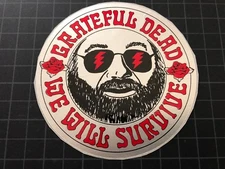 The Grateful Dead Jerry Garcia Touch of Grey WE WILL SURVIVE silver sticker 1991