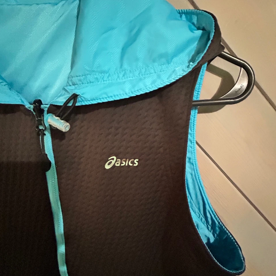 Chaleco reversible para mujer Asics con capucha cremallera completa entrenamiento correr mediano Foto 4 de 4