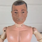 Vintage 1964 Hasbro G.I. Joe action figure with a soft head