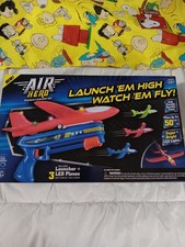 NEW AIR HERO AIRPLANE LAUNCHER SET WITH LAUNCHER AND 3 LED PLANES BATTERIES...