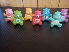 vintage Care Bears miniature figures, likely from the 1980s or early 2000s