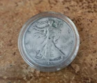 1945 s circulated Walking Liberty half dollar in acrylic capsule