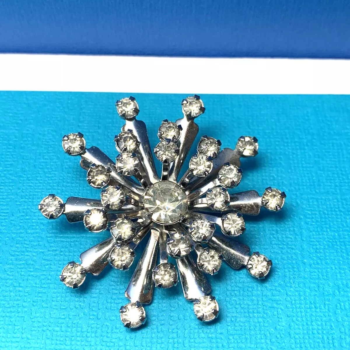 Rhinestone snowflake brooch deals