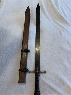 ANTIQUE KASKARA SWORD WITH UNIQUELY INSCRIBED BLADE AND LEATHER SCABBARD