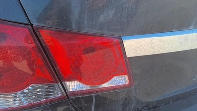 Used Left Tail Light Assembly fits: 2014 Chevrolet Cruze lid mounted Left Grade