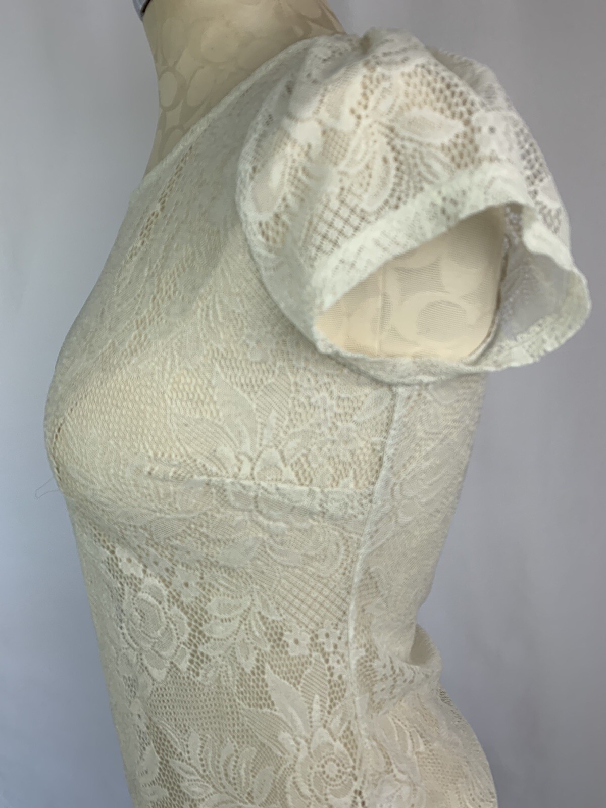 Top donna Small bar III prima fila pizzo avorio manica corta trasparente dettaglio cerniera