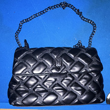 Black leather purse with red interior 