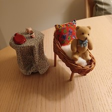 Dolls House Miniature Wicker Crib, Round Side Table And Toys.