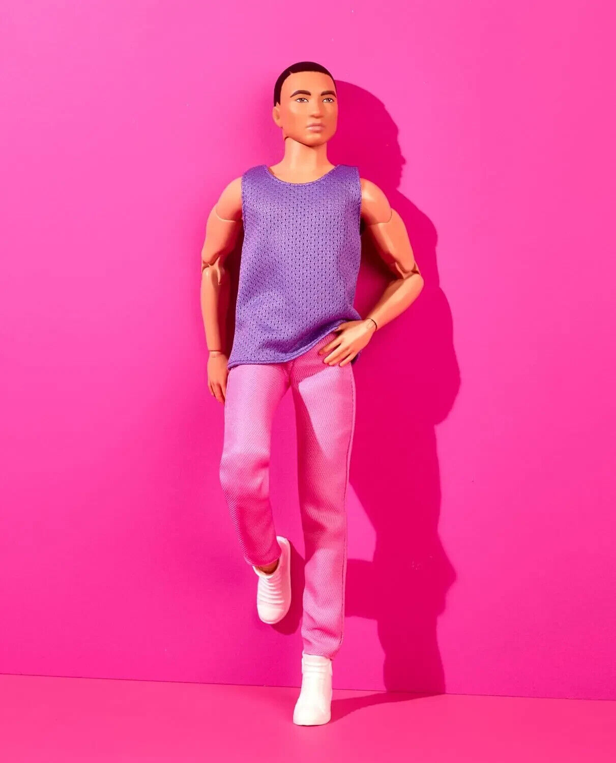Looks Ken Doll with Black Hair Dressed in Purple Mesh Top and Pink Trousers, Pos