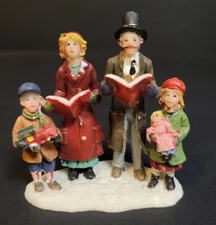 St. Nicholas Square Christmas Village Family Caroling Children With Toys Singing