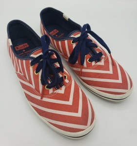 white keds with red stripe