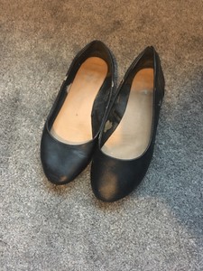 well worn ballet flats