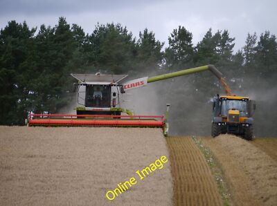 Photo 12x8 Discharging Grain Greenlaw/NT7146 One of two Claas Lexion 670s c2014