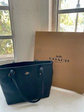 Coach Black Pebbled Tote with Logo Tag and Inner Pockets for Women