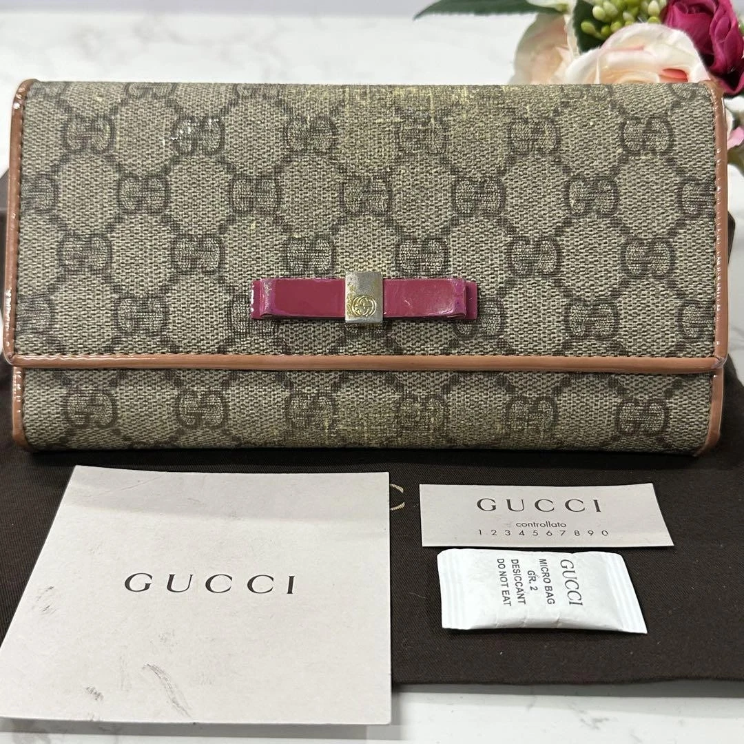 Portefeuille femme GUCCI double pli GG ruban suprême cuir authentique