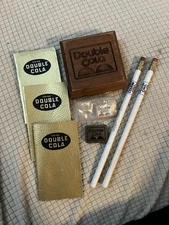 Lot 8 Double Cola Collectibles, Pencils, Pin, Booklets, Paper Wt., Wooden Symbol