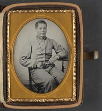 Unidentified soldier in Confederate uniform with lanyard around his neck