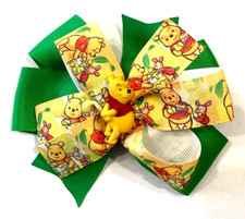 Beautiful Winnie the Pooh inspired hair bow for girls.
