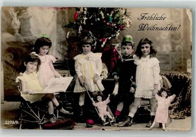 39876322 - Children's Dolls Book Reading Christmas 1907