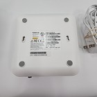 White Eero 6+Plus dual band mesh WiFi router with black top, yellow circle graphic, and printed specifications label.