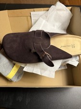 brown suede slip-on Clogs with a buckle detail. Perfect for casual wear