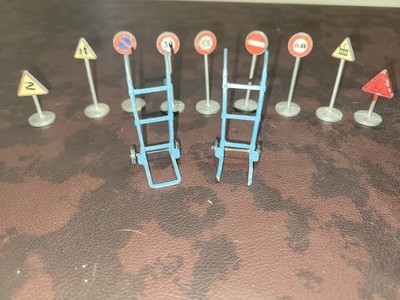 7 DINKY BRITISH ROAD SIGNS AND 2 DOLLYS