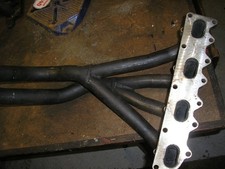 Four branch exhaust manifold. Possibly Ford Escort.