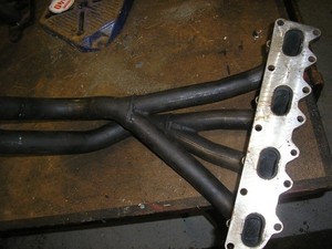 Four branch exhaust manifold. Possibly Ford Escort.