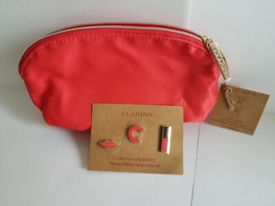 CLARINS PINK COSMETIC TRAVEL BAG WITH CLARINS LOGO PINS . BUY 1,2
