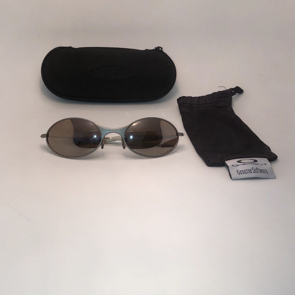 Pre-Owned Oakley T Wire 1.0 TITANIUM/TITANIUM IRIDIUM Pre-Owned Oakley T Wire 1.0 TITANIUM/TITANIUM IRIDIUM