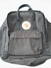 Fjallraven Kanken Black Full Size Backpack And Matching Tablet Case.