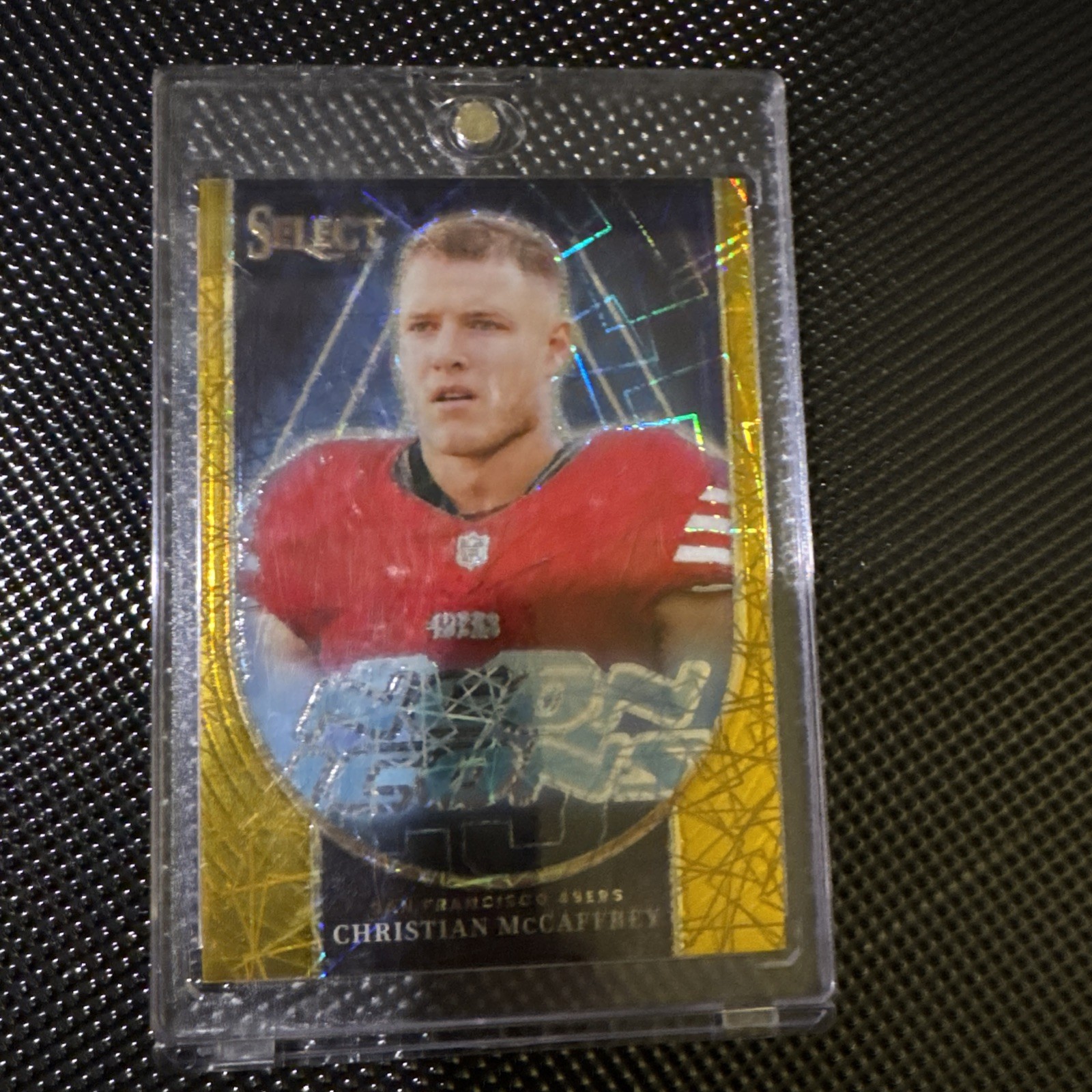 2023 Panini Select - Neon Icons Christian McCaffrey #NI-CMC Gold Prizm /10